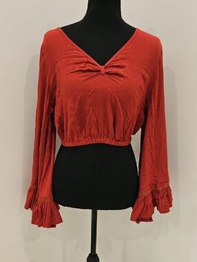 EARTHBOUND Rust Red Cropped V-Neck Top with Knot Detail. Size M